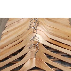 Beautiful Wood hangers: 10 regular hangers and 15 pant hangers.